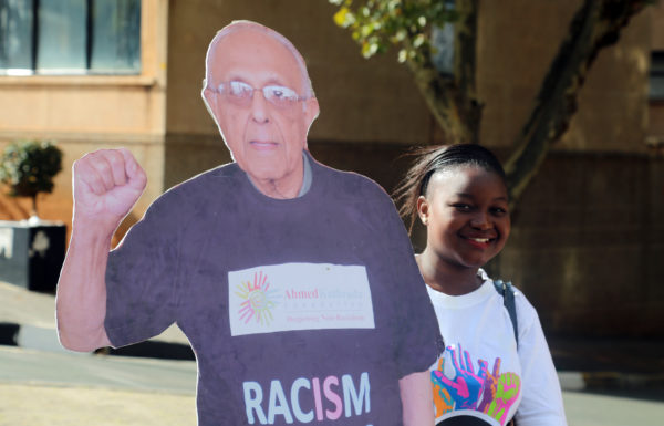 Constitution Hill: A walker poses with a cutout of South African human rights icon Ahmed Kathrada.